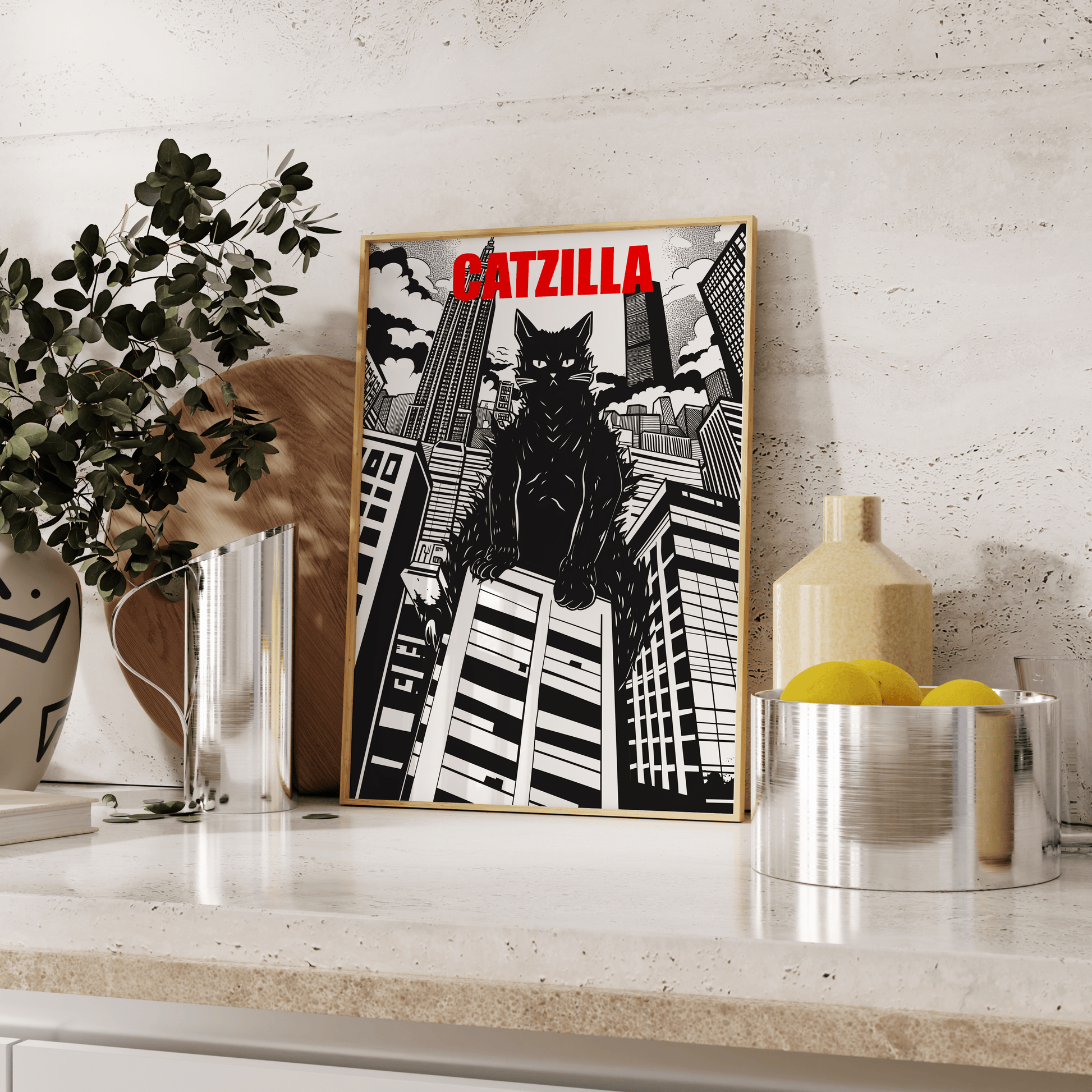 Framed poster of a manga Catzilla over large buildings, Black and White, leaning against the kitchen counter - Paw Prints