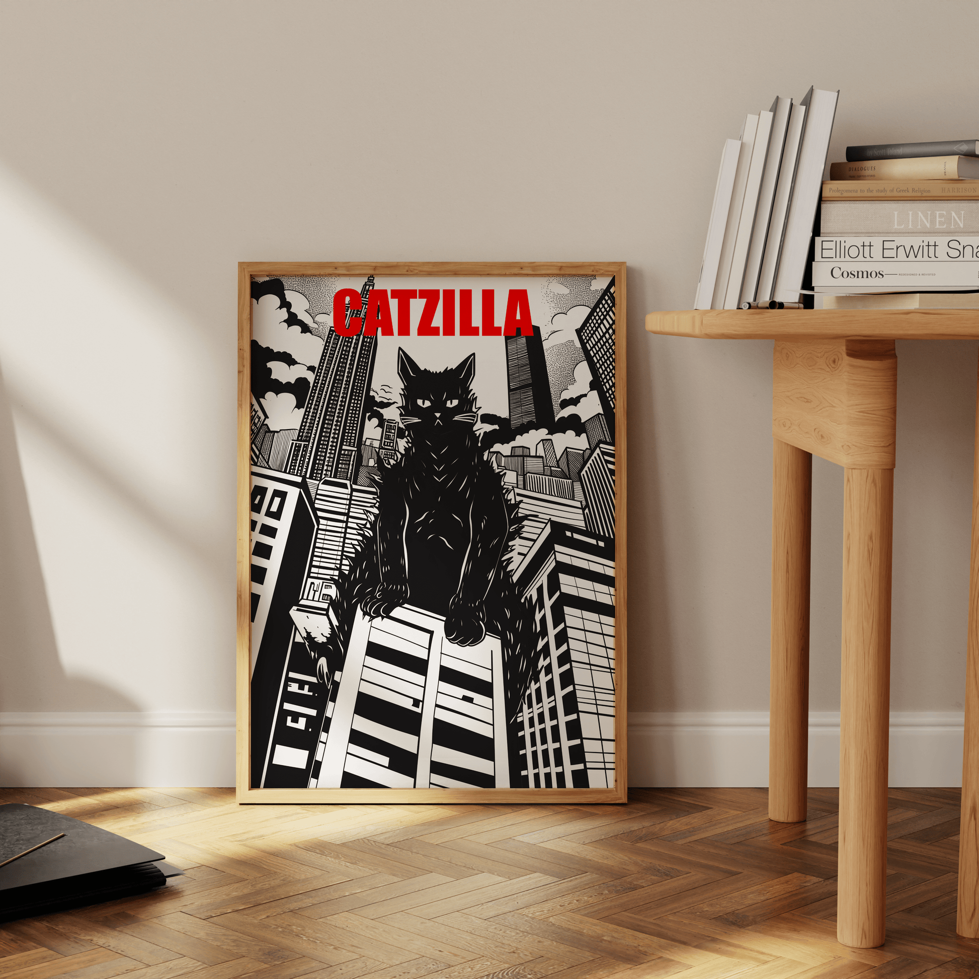 Framed poster of a manga Catzilla over large buildings, Black and White, leaning against the office wall - Paw Prints